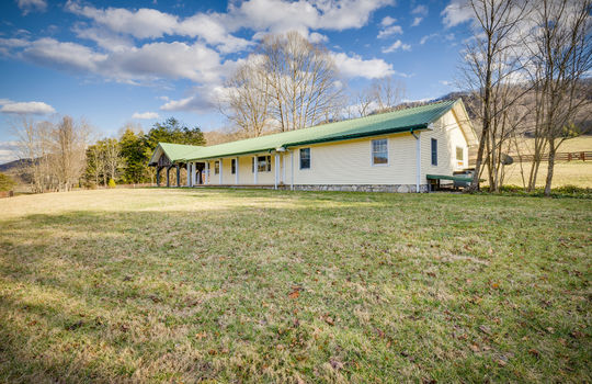 front right side view of home, ranch home, metal roof, covered front porch, covered patio/carport
