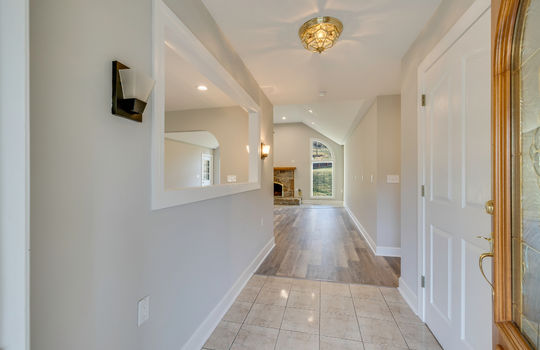 Foyer, tile flooring, hallway