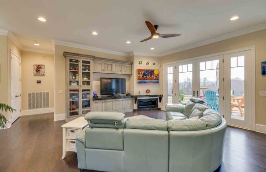 living room, hardwood flooring, ceiling fan, windows, recessed lighting