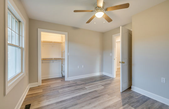 bedroom, ceiling fan, luxury vinyl plank flooring, walk in closet
