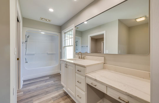 second bathroom, sink, luxury vinyl plank flooring, shower/tub, window, recessed lighting