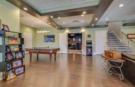 lower level living area, recessed lighting, luxury vinyl flooring