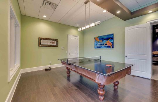 lower level living area, recessed lighting, luxury vinyl flooring