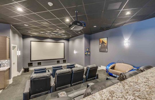 home theatre, carpet, reclining seating, movie screen, projector, tiered seating