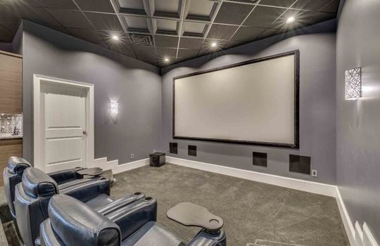 theater room, reclining seats, movie screen, carpet