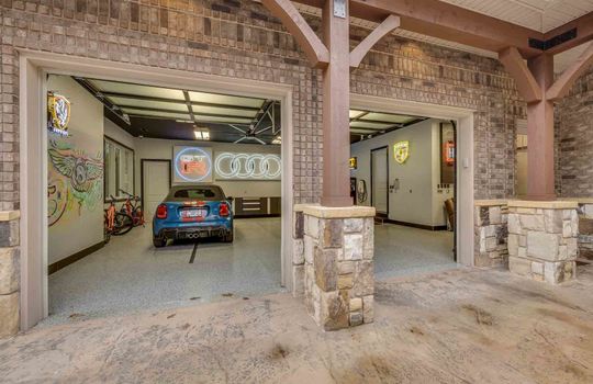 front garage, garage doors, asphalt driveway, concrete flooring