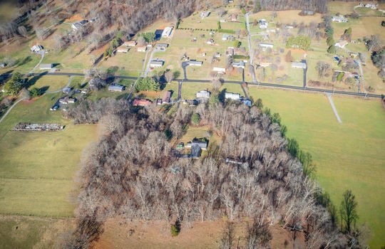 aerial view of property, 7.45+/- acres, mountains, trees, neighborhood