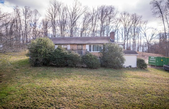 front yard, bushes, driveway, trees, one level brick ranch