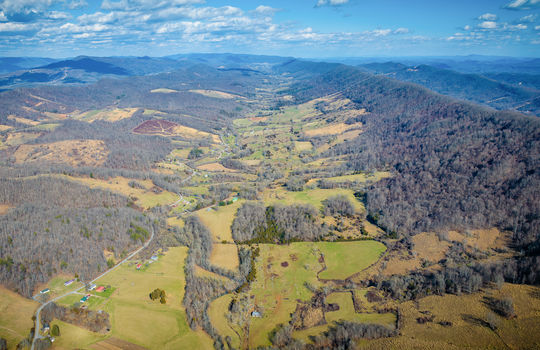 aerial view of property, mountain views, valley