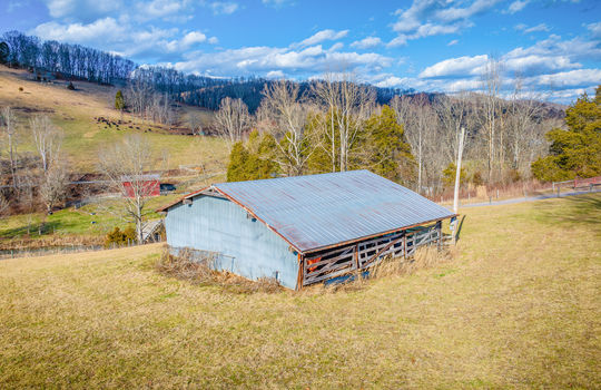 large storage barn, metal roof, yard, pasture, mountain views