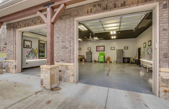 stand alone garage, garage doors, concrete pad, conccrete flooring, ceiling fan