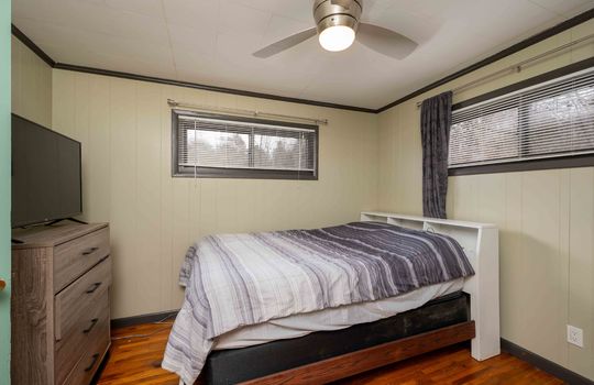 bedroom, hardwood flooring, windows, ceiling fan