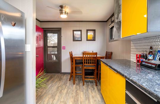 kitchen/dining combo, modern kitchen cabinets, dishwasher, refrigerator, dining area, dining area, ceiling fan, back door, tile backsplash
