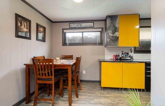 kitchen dining combo, dining area, luxury vinyl flooring, window, modern cabinetry