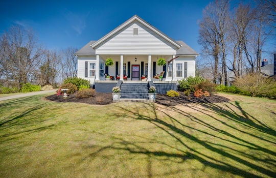 historic two level home, front steps, front door, front yard, landscaping, vinyl siding