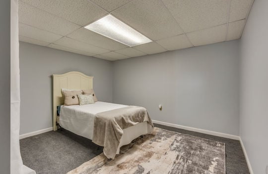 bedroom, carpet, ceiling tiles, fluorescent lighting