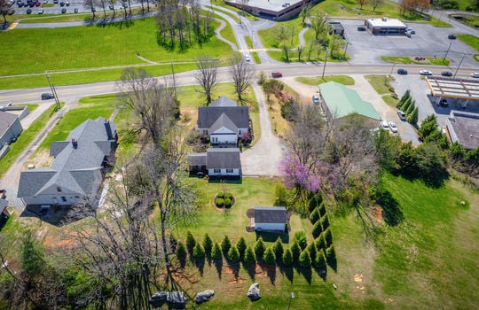 back yard aerial view toward road, house, back yard, detached garage, storage house, mountain views
