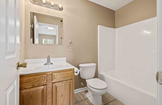 full bath, sink, toilet, shower/tub, tile flooring