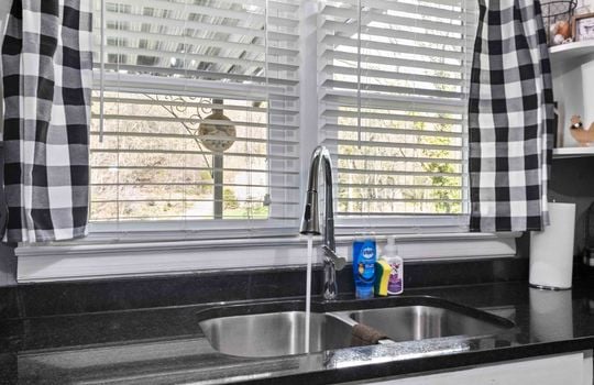 kitchen sink, granite countertops, window above sink,