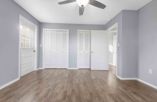 bedroom, double closets, ceiling fan, luxury vinyl flooring, exterior door