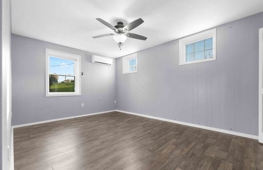 bedroom, windows, ceiling fan, luxury vinyl flooring