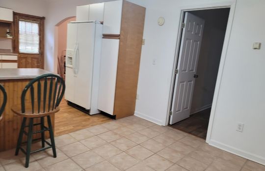 kitchen, bar seating, dining area, vinyl tile,