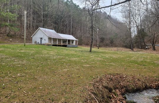 One story traditional home, 29.44+/- acres, creek, trees, mountains,