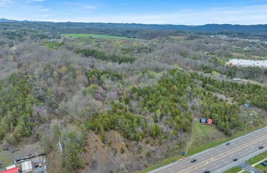 48+/- acres, Stone Drive, Kingsport, undeveloped land, trees, businesses, Road, four lane, aerial photo, mountain views