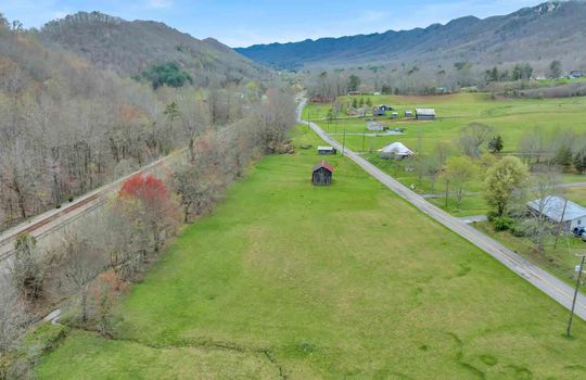 aerial view, land across road, road, 14.75+/- acres, cleared building spot, outbuilding, mountain views