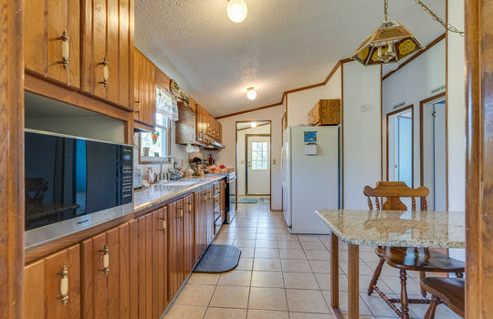 kitchen, cabinets, tile flooring, eat in kitchen space, sink, window above sink