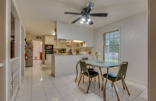 dining area, eat in kitchen, ceiling fan, tile flooring, kitchen area