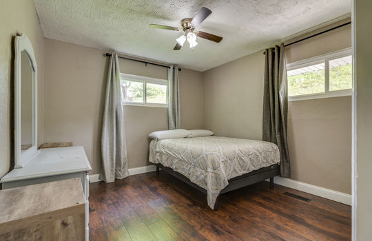 bedroom, ceiling fan, luxury vinyl flooring, windows