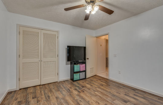bedroom, vinyl flooring, closet, ceiling fan