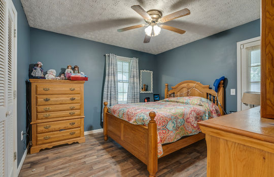 bedroom, vinyl flooring, ceiling fan, window