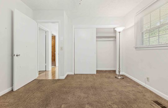 bedroom, carpet, closet, door to hallway