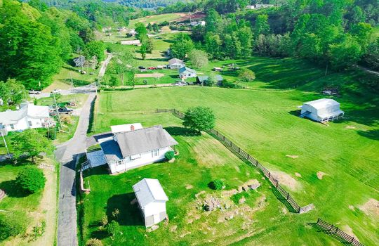 aerial view of farmhouse, shed, and barn, 3+/- acres, yard, trees, mountain(s), field