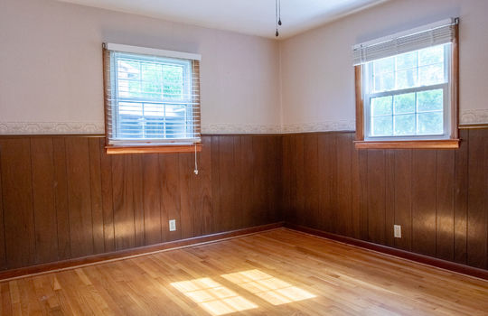 bedroom, hardwood flooring, wainscoting, windows, ceiling fan