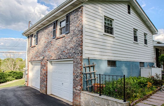 tri-level ranch, drive under two car garage, landscaping, brick, vinyl siding