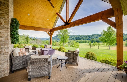 Covered front porch/deck, wood ceiling, outdoor fan, decorative beams, mountain views