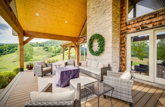Covered front porch/deck, wood ceiling, outdoor fan, decorative beams, mountain views
