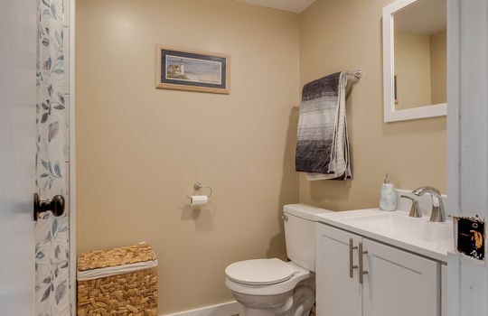 second bathroom, sink, toilet, but/shower, laminate flooring