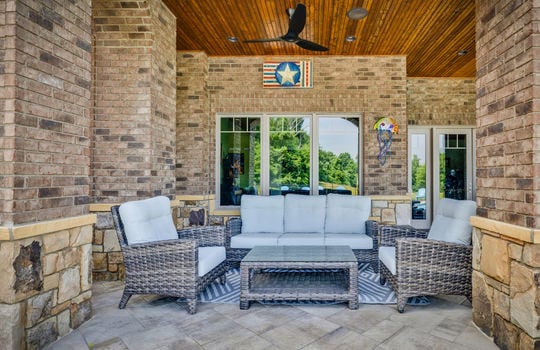 lower level patio, patio pavers, brick home exterior, outdoor fan