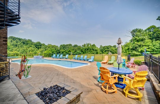 swimming pool, firepit, fencing, view of pasture,