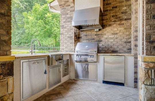 lower level outdoor kitchen, sink, grill, stainless appliances