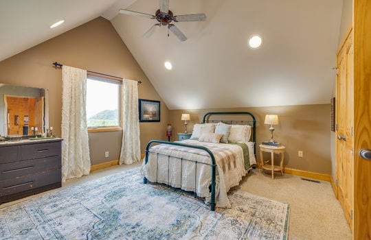 bedroom, carpet, vaulted ceiling, recessed lighting, door, ceiling fan, window