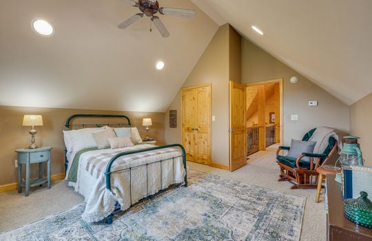 bedroom, carpet, vaulted ceiling, recessed lighting, door, ceiling fan, closet, doorway