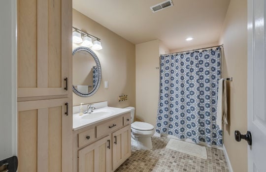 bathroom, tile flooring, sink, toilet, shower/tub