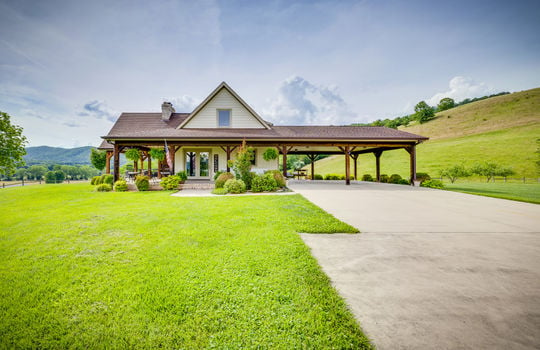 craftsman style home, concrete driveway, covered carport, HardiPlank siding, covered porch, mountain views