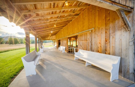 event venue barn, covered porch, concrete flooring
