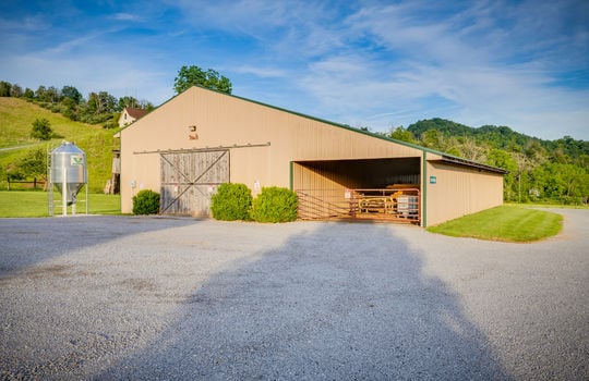 gravel driveway, metal hay barn, equipment storage, mountain views